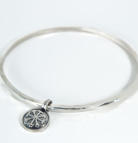 Sterling silver Lagu bangle with Vegvisir charm on white background
