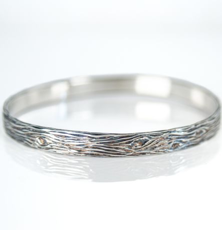 Sterling silver 6mm wood grain bangle textured wide band on white background