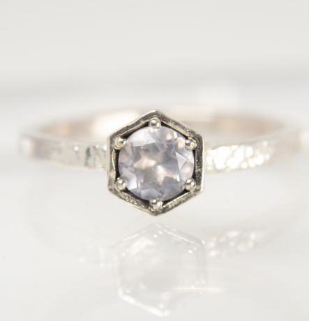 Handmade silver Strykke ring featuring a rose quartz gemstone in a minimalist silver setting, photographed on a white background
