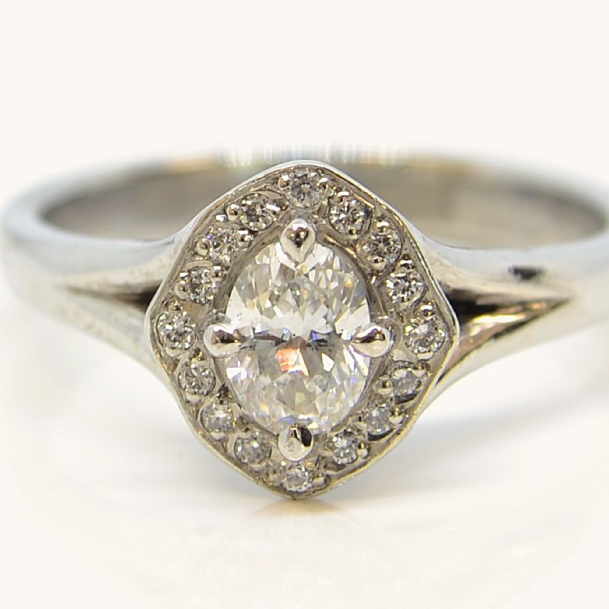 Diamond halo engagement ring in Platinum