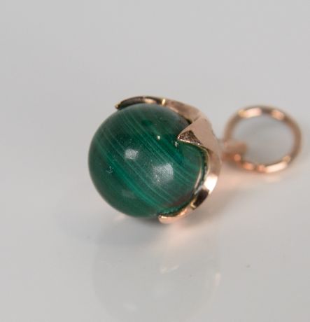 9ct rose gold Ferian pendant with malachite bead on white background