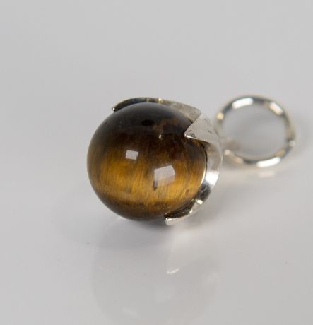 Silver Ferian pendant with tiger’s eye bead on white background