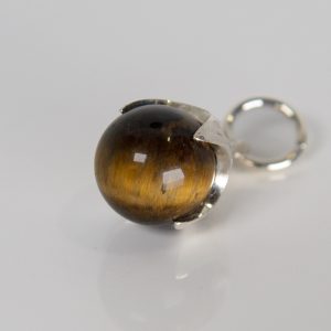 Silver Ferian pendant with tiger’s eye bead on white background